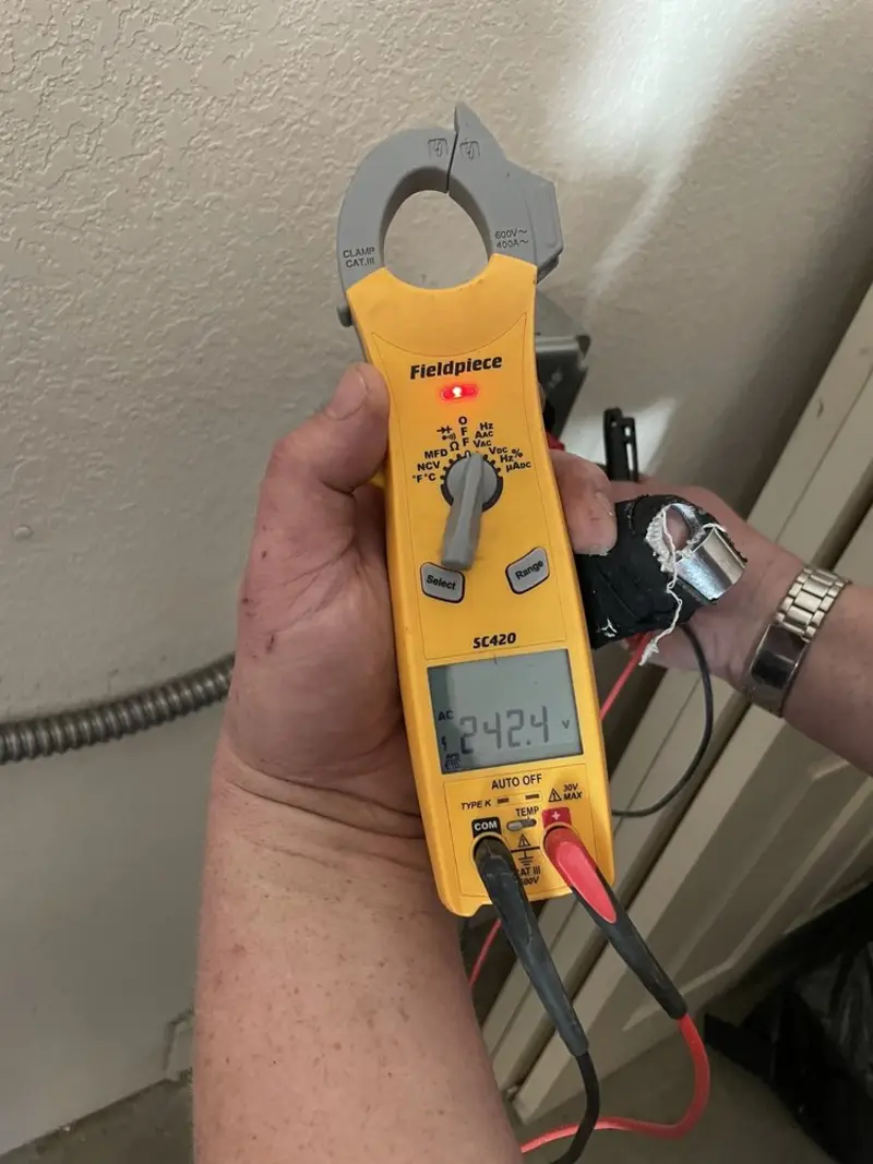 Voltage testing with clamp meter during Electrical Installation Services in Echols County